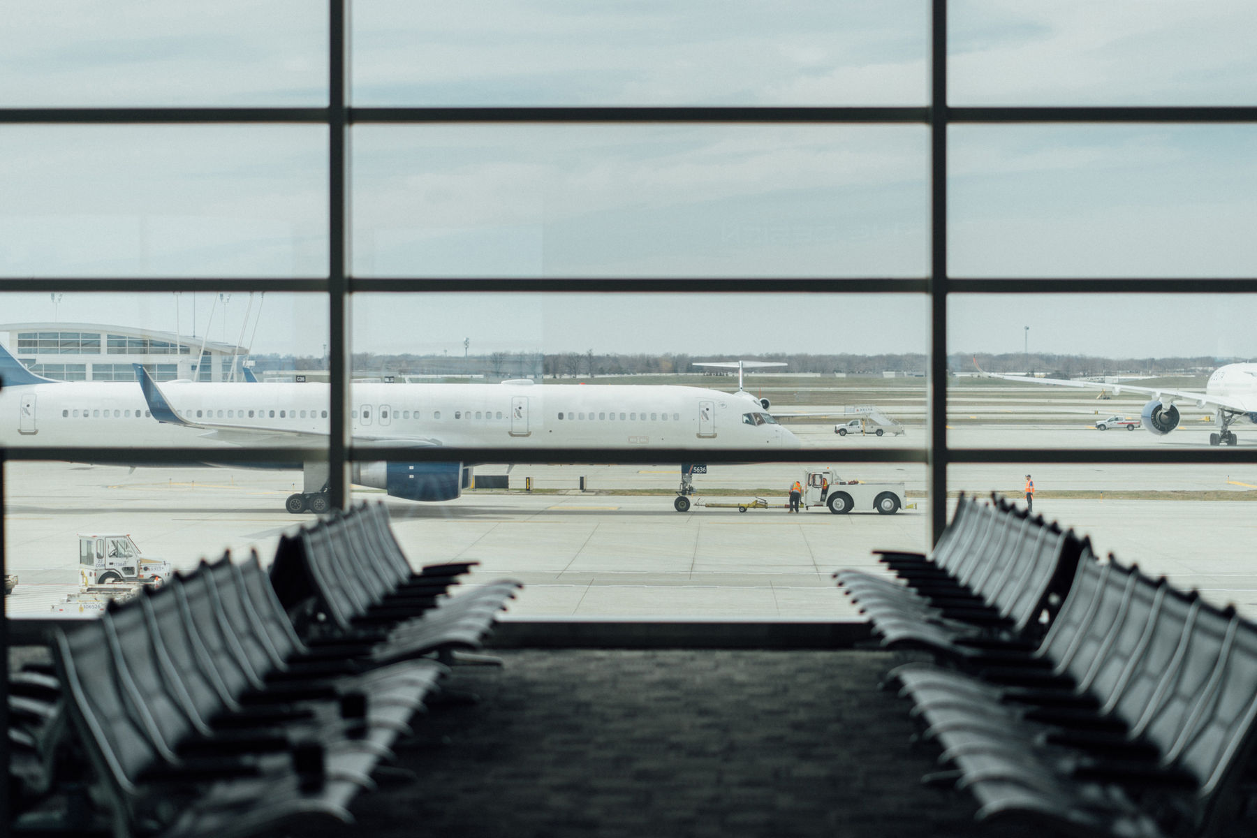 Airport departure lounge with a plane on the tarmac