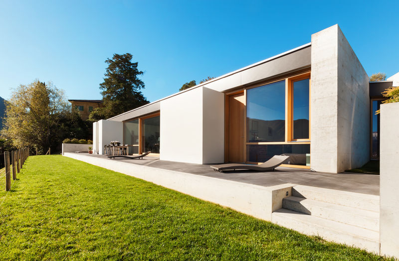 Modern house with a lawn under a blue sky